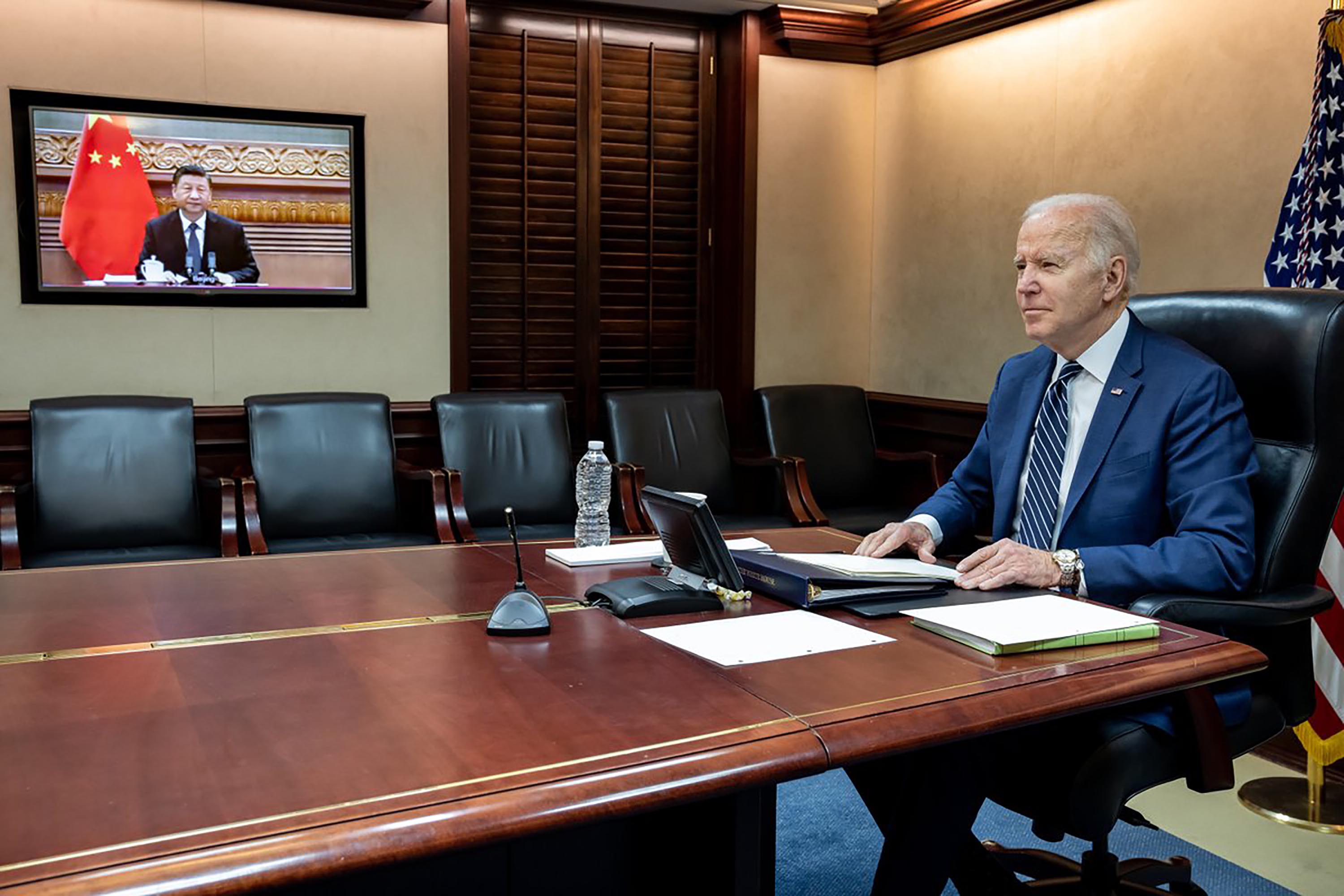 In this photo released by the White House, US President Biden speaks with Chinese President Xi Jinping on Friday, March 18.