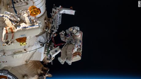 Russian cosmonauts Denis Matveyev and Oleg Artemyev worked outside the Russian part of the station for six hours and 37 minutes on April 18.  Artemyev appears, recognizable by his red stripes in a space suit.