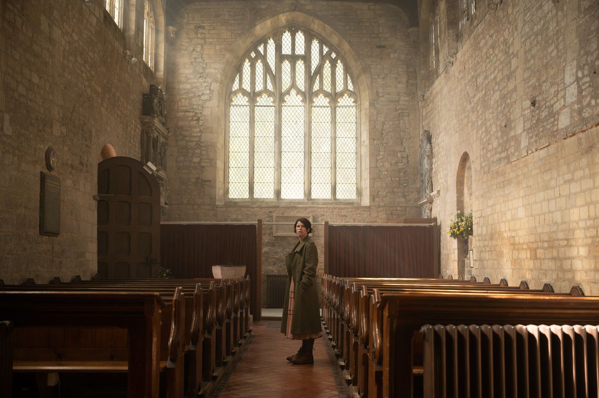 Harper (Jessie Buckley) stands in the middle of a massive open chapel space in Alex Garland's Men.
