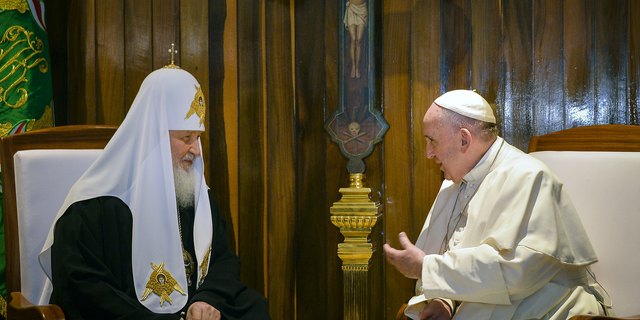 Head of the Russian Orthodox Church Patriarch Kirill, left, and Pope Francis speak during a meeting at Jose Marti Airport in Havana, Cuba, in February 2016.