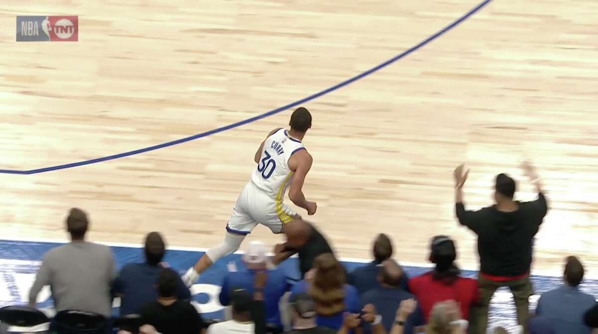 Warriors star Steve Curry flies on a bartender's beer tray on the field just before the break against the Dallas Mavericks on May 22, 2022.