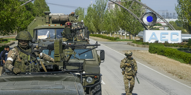 A Russian military convoy stands on the road to the Zaporizhzhya nuclear power plant in southeastern Ukraine on Sunday, May 1. 