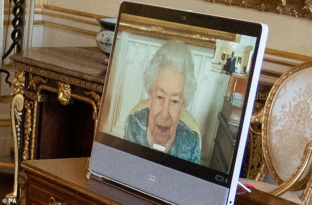 Queen Elizabeth II, a resident of Windsor Castle, appears on screen via video link during a virtual audience at Buckingham Palace in London today.