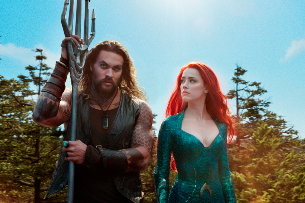 This image was published by Warner Bros.  The photos show Jason Momoa, left, and Amber Heard in a scene from "Aquaman." (Warner Bros. photos via AP)