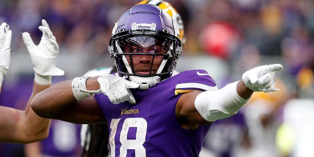 Justin Jefferson, No. 18, the Minnesota Vikings receiver, celebrates after getting a pass for the first time during the second half of an NFL football game against the Green Bay Packers, Sunday, September 11, 2022, in Minneapolis. 