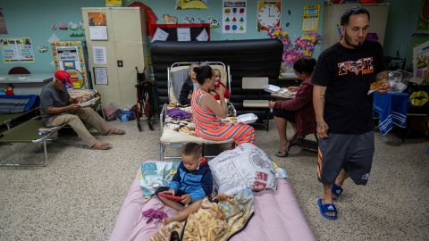 Evacuees take refuge in the classroom at a public school in Guayanila, Puerto Rico.