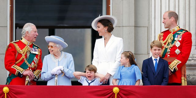 (LR) Then-Prince Charles poses on Buckingham Palace balcony with Queen Elizabeth II, Prince Louis, Kate Middleton, Princess Charlotte, Prince George and Prince William in June as she celebrates their platinum jubilee. 