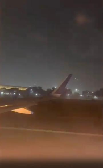 The plane takes off at Delhi airport before it catches fire.
