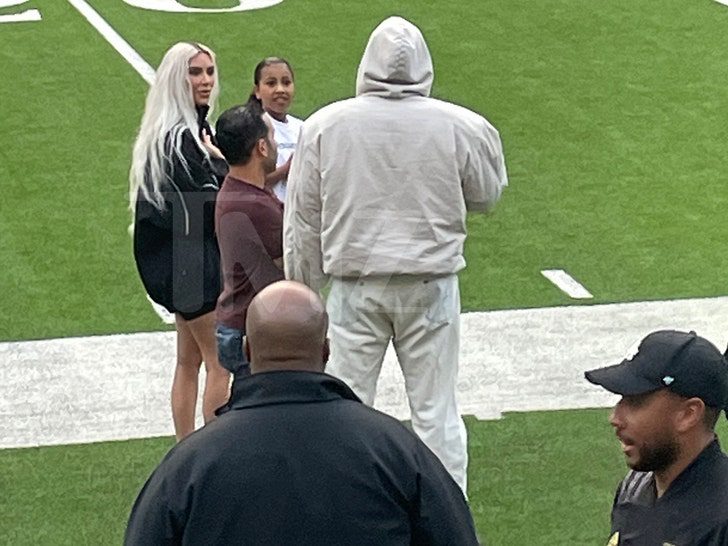 Kanye West and Kim Kardashian at a Saints football match