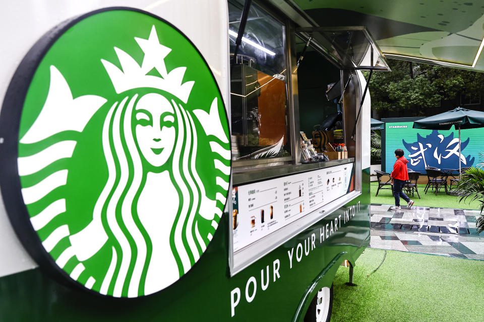 An employee serves in a Starbucks coffee truck at Wuhan International Plaza on October 6, 2022 in Wuhan, Hubei Province, China.  (Photo by Getty Images & #x00ff09;