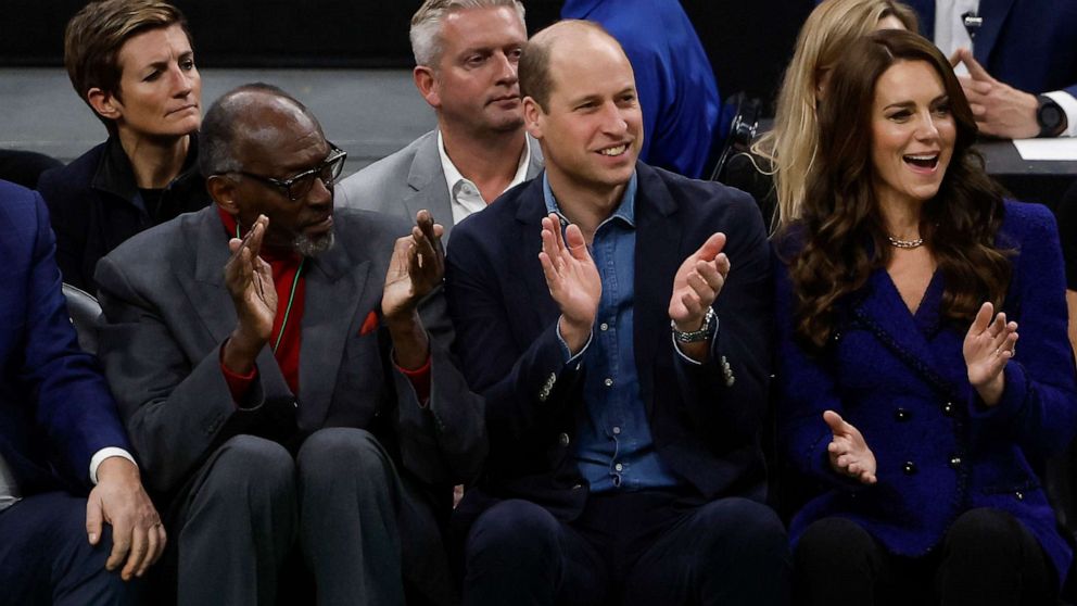 PHOTO: Prince William, Prince of Wales, and Catherine, Princess of Wales cheer along with Boston Celtics great and Hall of Famer Satch Sanders, left, watching the NBA basketball game between the Boston Celtics and Miami Heat on November 30, 2022 in Boston.